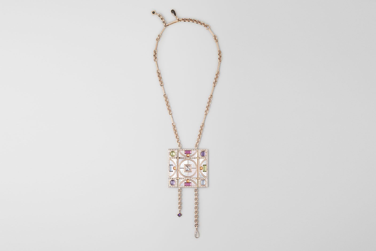  Hermès Couleurs du jour triptych necklace in rose gold with outer panels in black jade with pavé-set black spinels and inner panels in white mother-of-pearl set with one diamond (2.5 carats), peridots, amethysts, tourmalines, aquamarines, spessartite garnets, and moonstone, with pavé-set diamonds and baguette-cut diamonds, from the Les Jeux de l'ombre High Jewellery collection