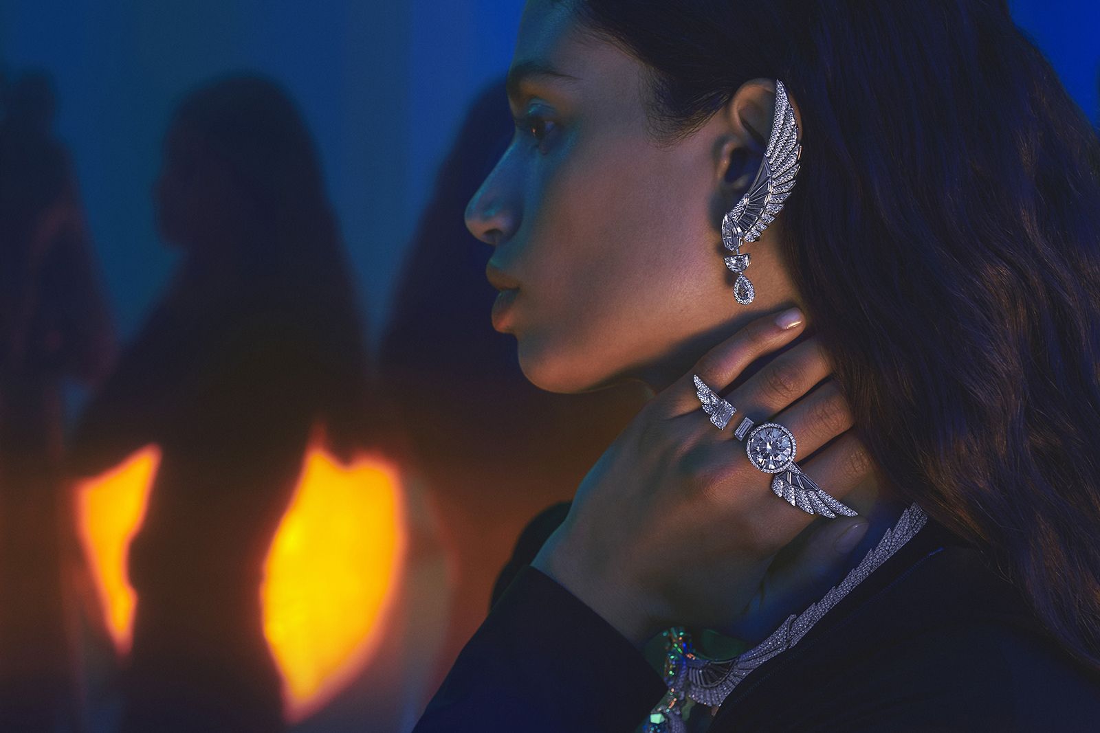  Model wearing Messika white gold and diamond Akh-Ba-Ka asymmetrical earring, rings and necklace from the Beyond the Light High Jewellery Collection