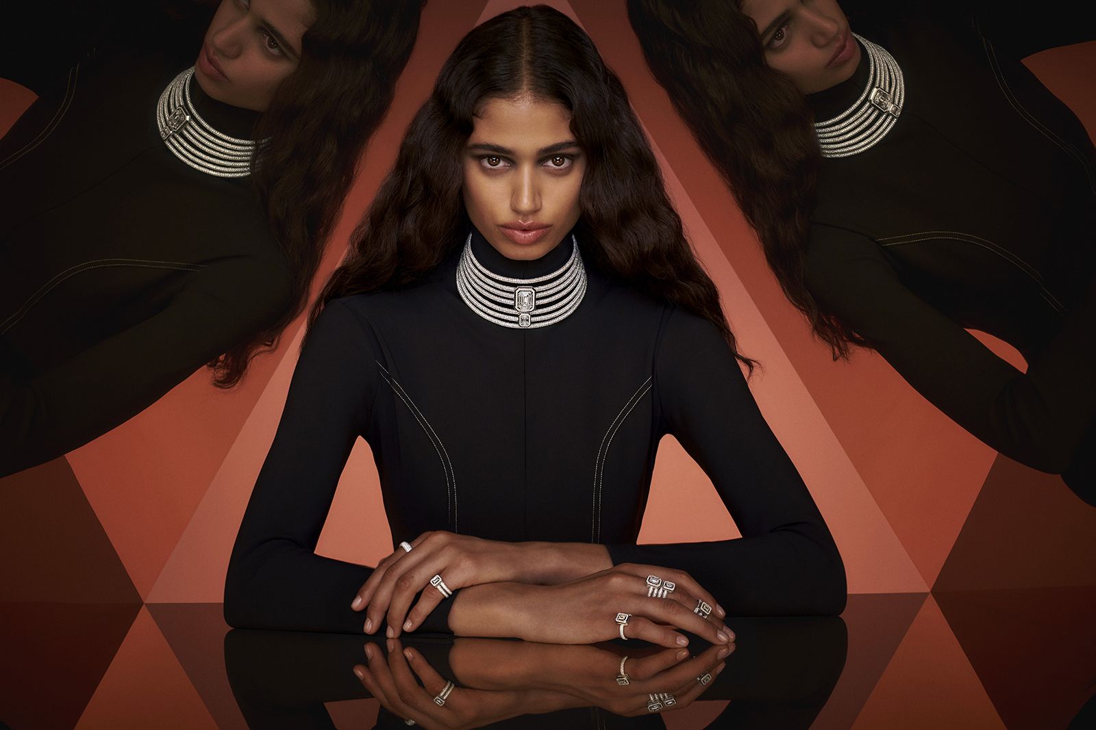 Model wearing Messika white gold and diamond pave Divine Enigma choker and rings from the Beyond the Light High Jewellery collection 