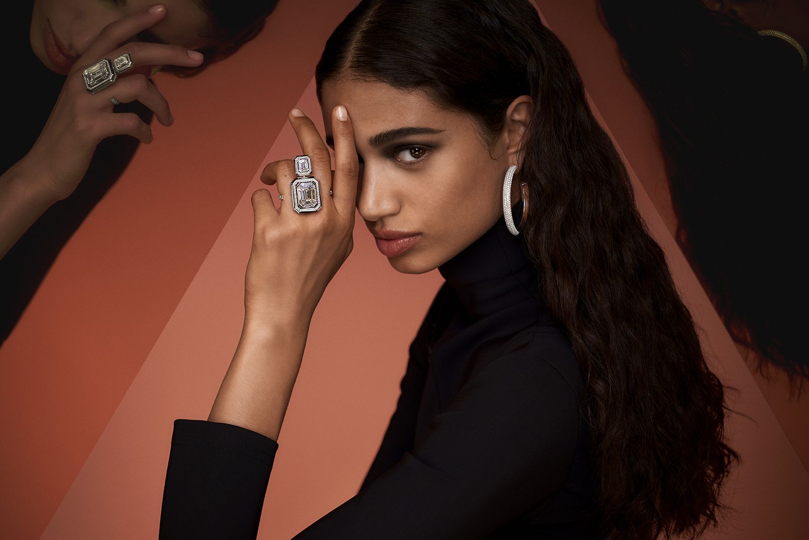  Model wearing Messika white gold and diamond Divine Enigma hoop earrings and transformable ring from the Beyond the Light High Jewellery collection