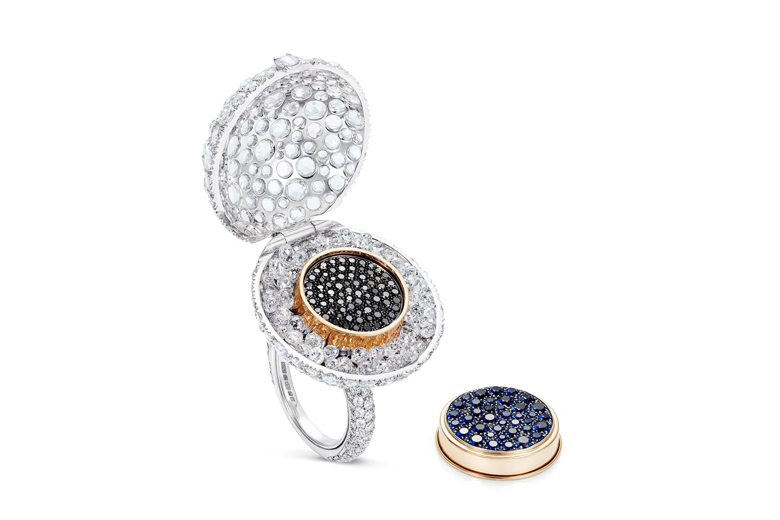  The K&Co London Caviar ring opens to reveal a blue sapphire-set lid that lifts to reveal black diamond caviar
