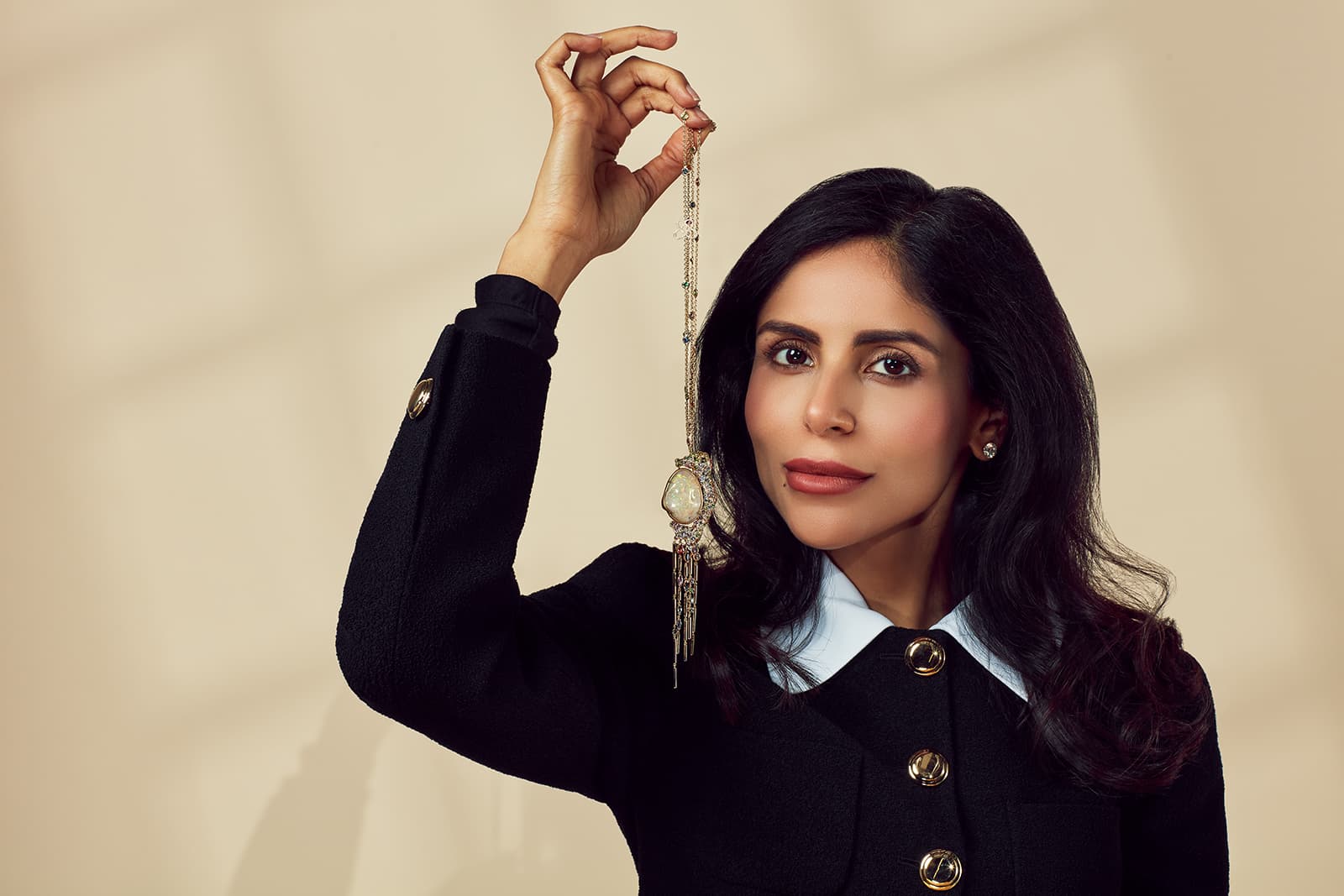 Karina Choudhrie of K&Co London holding the Aurelia Aurita sautoir necklace