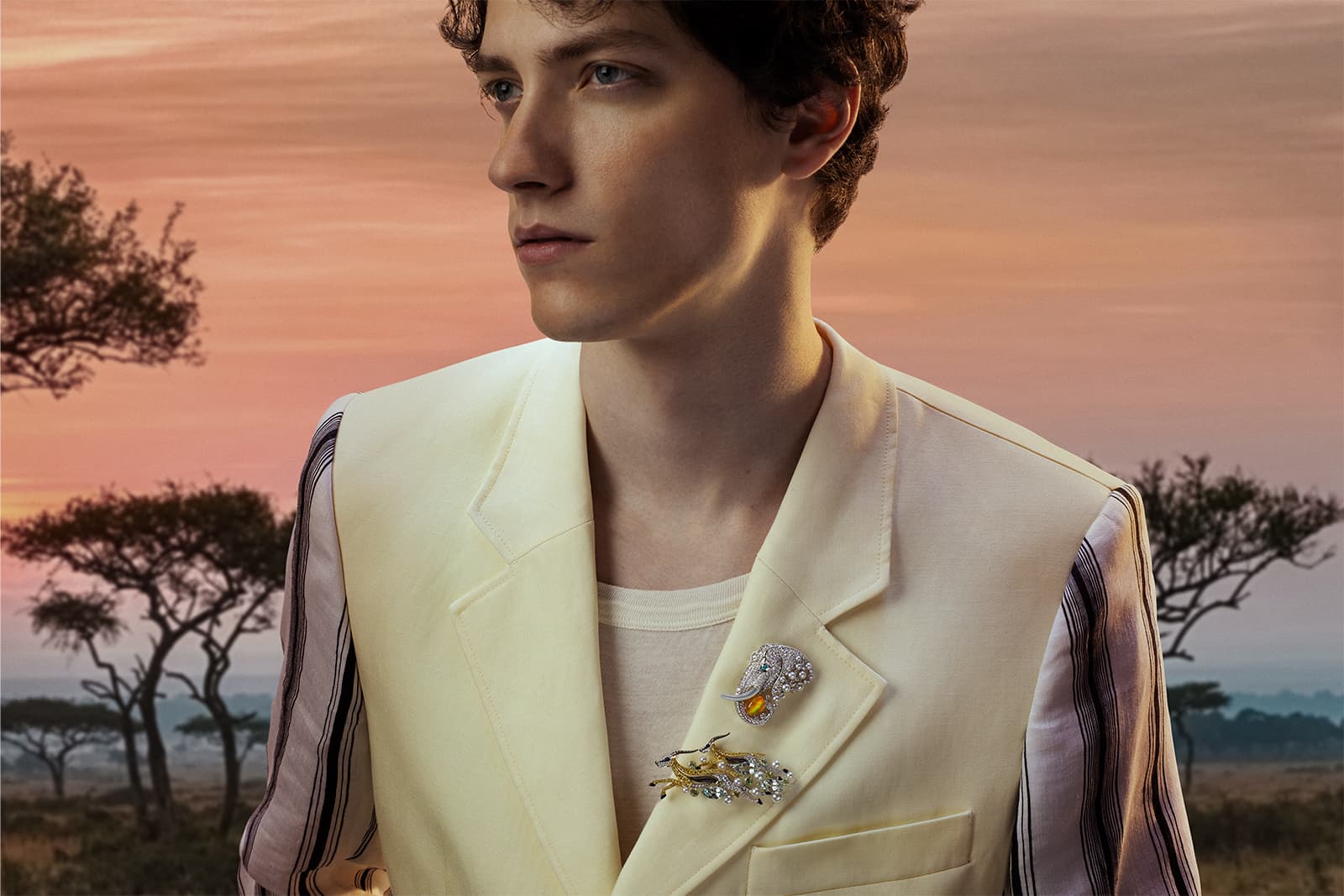  Model wearing Mikimoto Africa brooches with Akoya cultured pearls, diamonds and coloured gemstones from the Wild and Wonderful High Jewellery collection