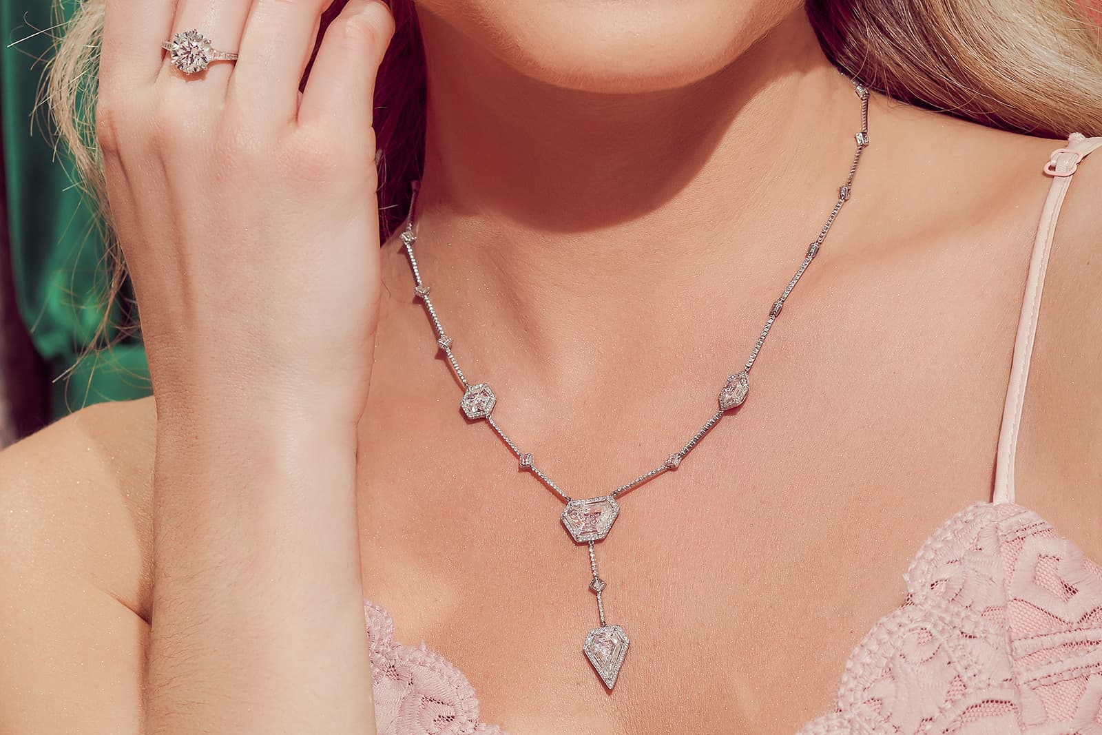  Model wearing Stephen Silver platinum, pink diamond and white diamond necklace and ring