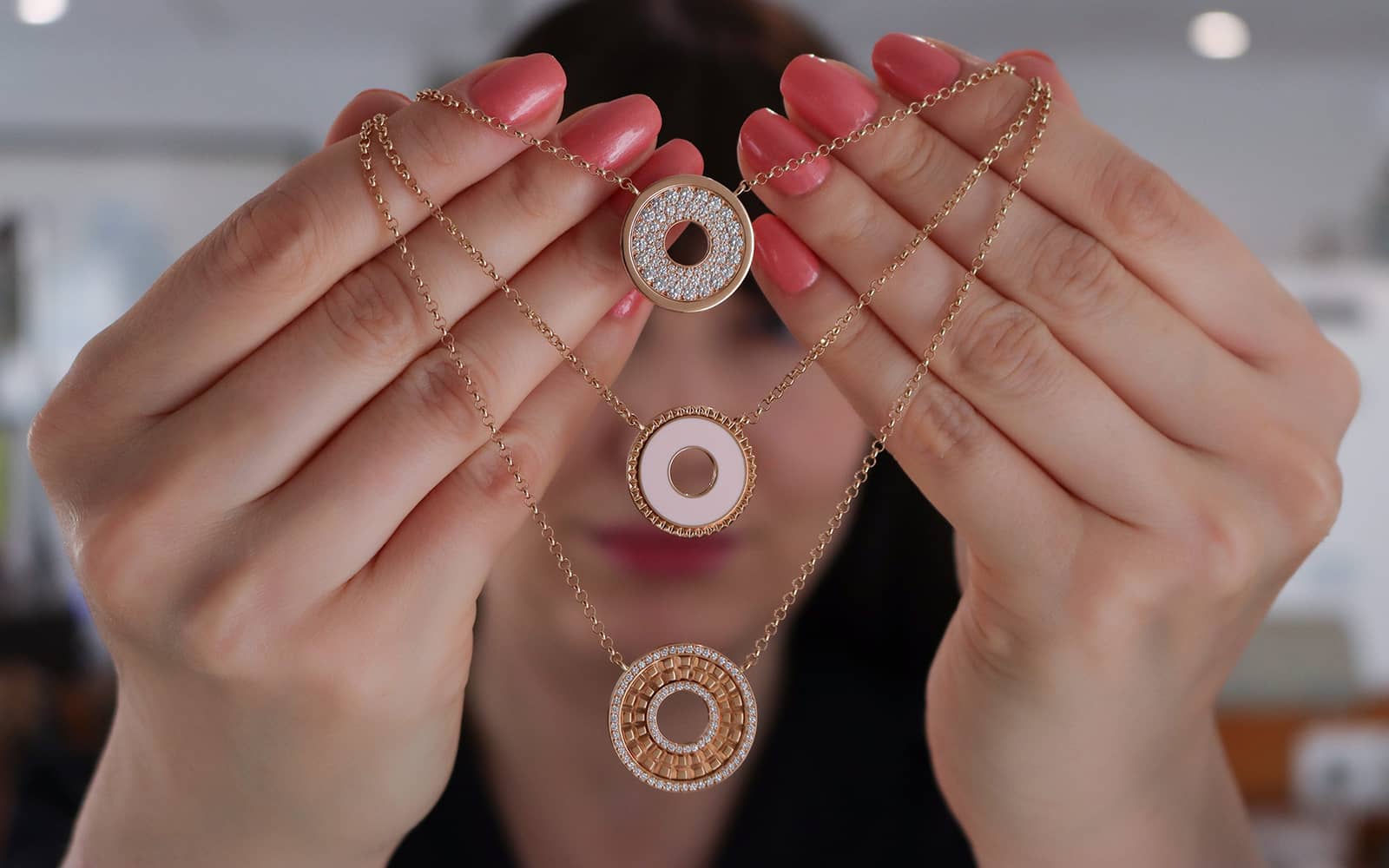 Ferrat Paris necklaces from top to bottom: the Paris necklace with diamonds; the Don’t Take Me For Granted necklace with pink lacquer, and the Triomphe Double Round necklace with diamonds, all in rose gold