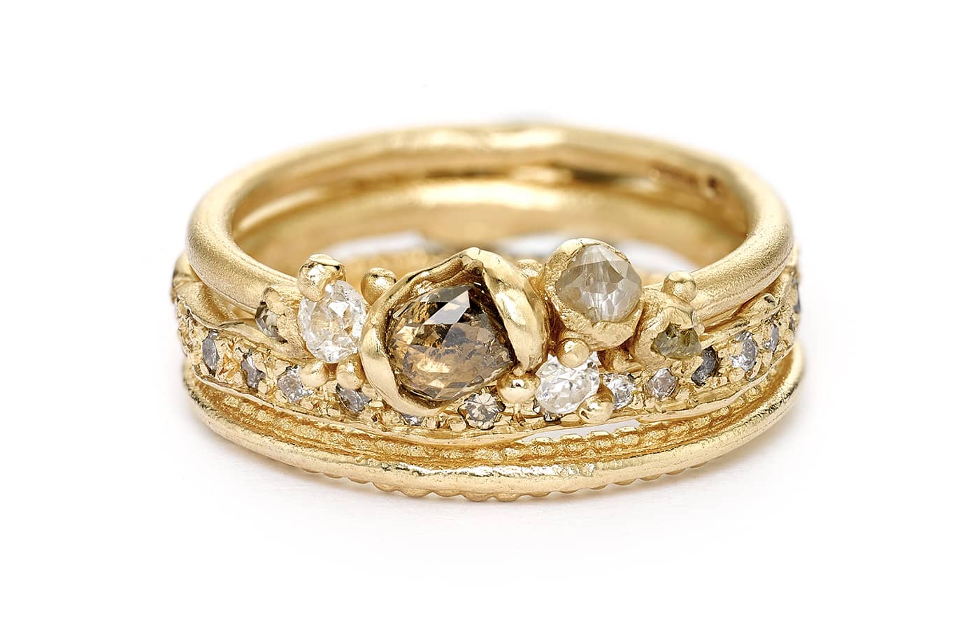  Ruth Tomlinson 14k yellow gold ring stack set with white, grey and champagne diamonds 