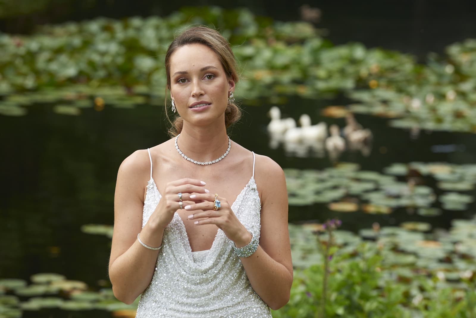  model wearing gold, diamond and aquamarine jewellery by Susannah Lovis