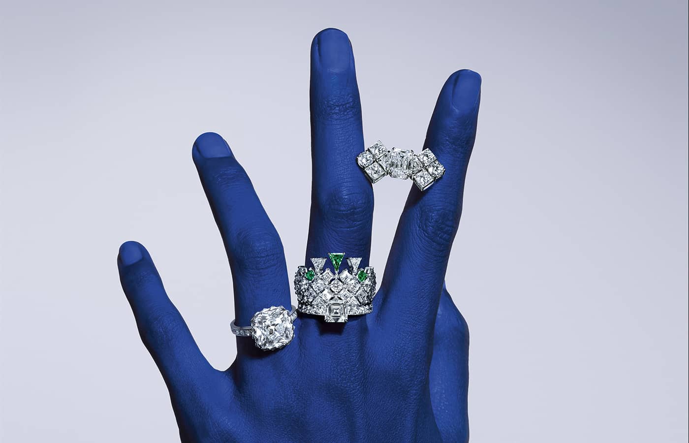 Model wearing the Piaget Shimmering Savor rings in diamond and white gold, featuring a  4.03-ct. old mine cushion-cut diamond, from the Solstice by Piaget High Jewellery Collection, Chapter Two
