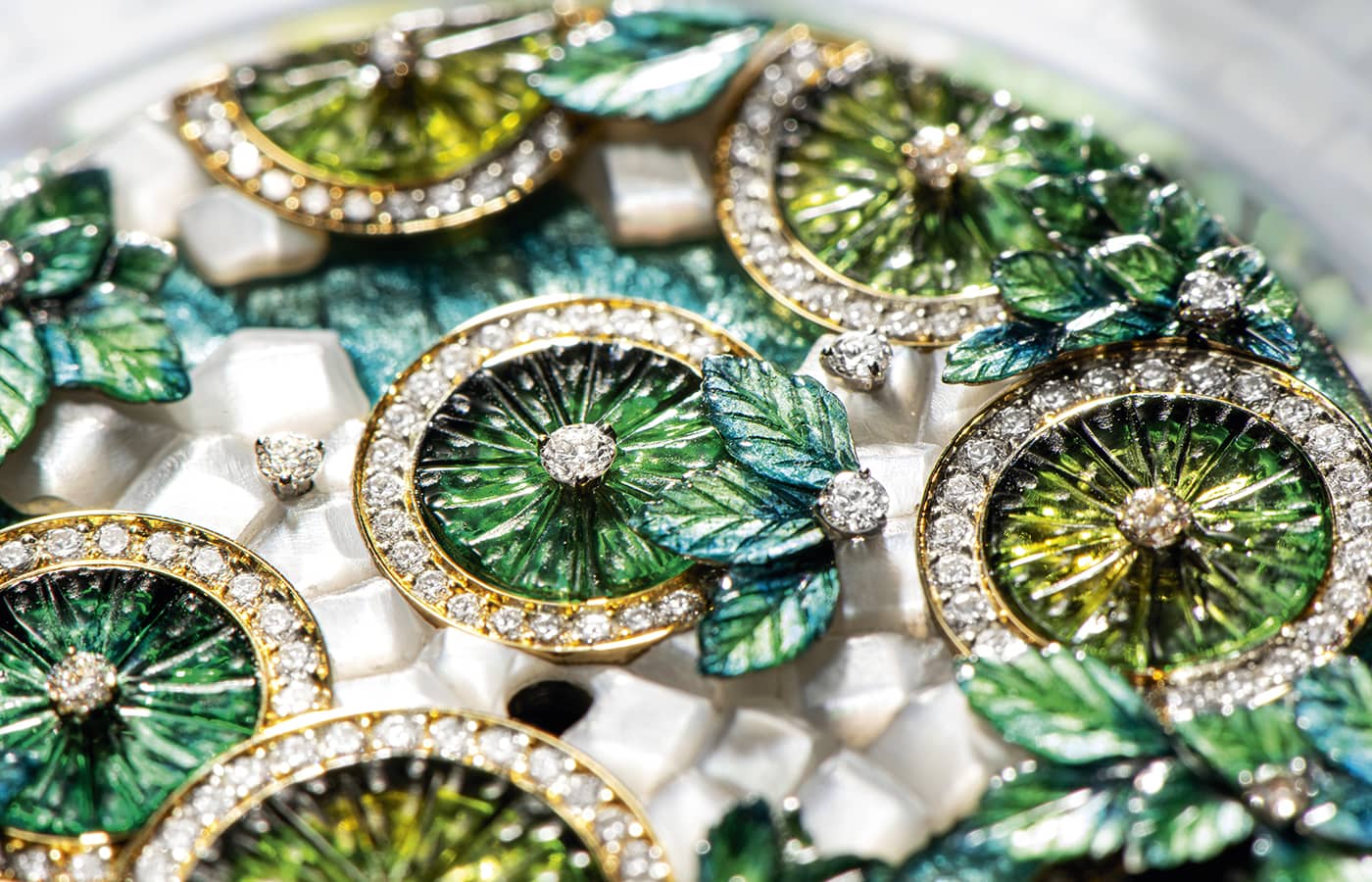  Close of the Piaget Joyful Sharing Watch dial in diamond, mother-of-pearl and peridot glyptic by Dick Steenman and enamel by Anita Porchet, from the Solstice by Piaget High Jewellery Collection, Chapter Two