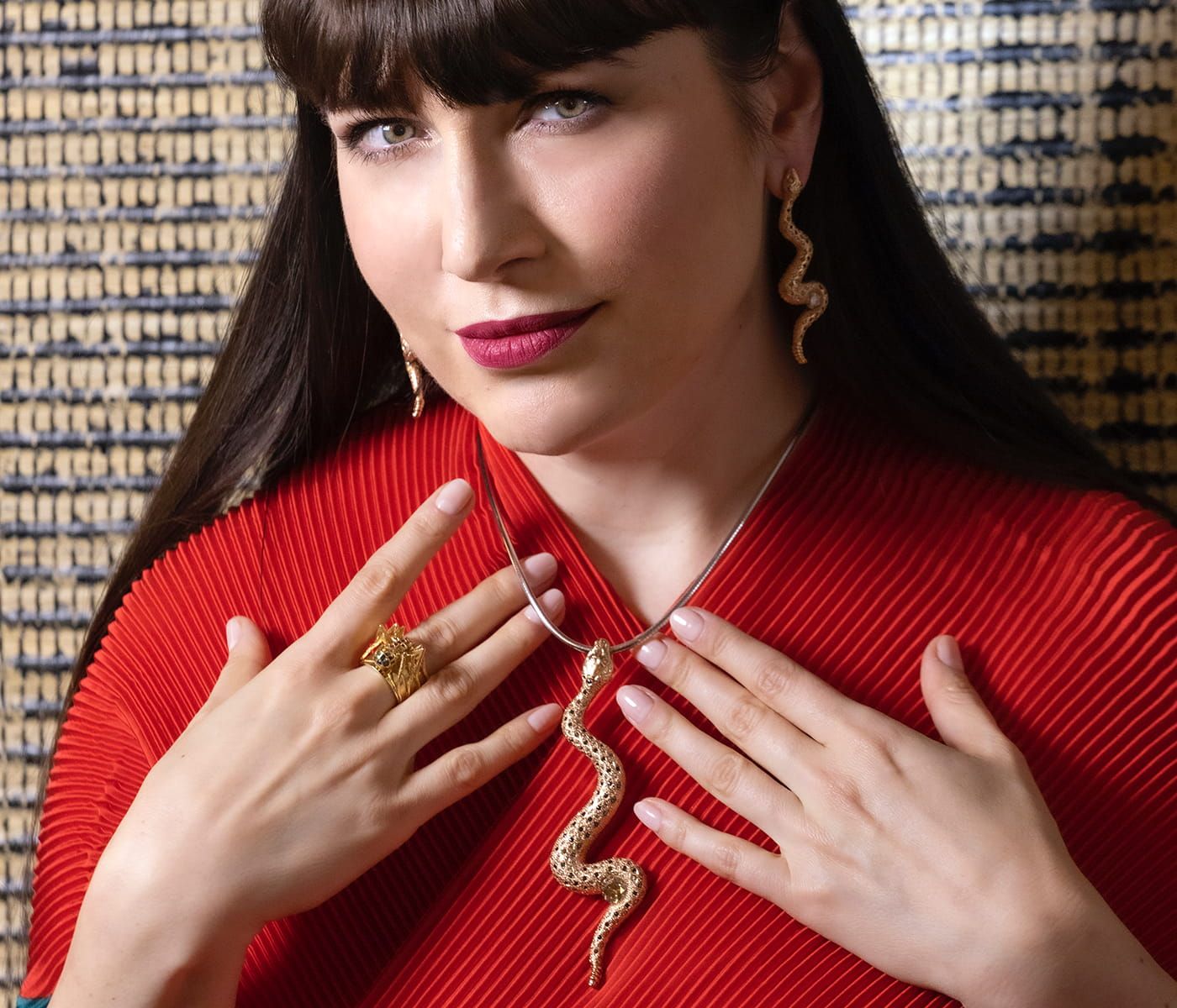 Katerina Perez wears the Snake necklace by Nathalie Knauf Jewels in 18k yellow gold with white, black and champagne diamonds 