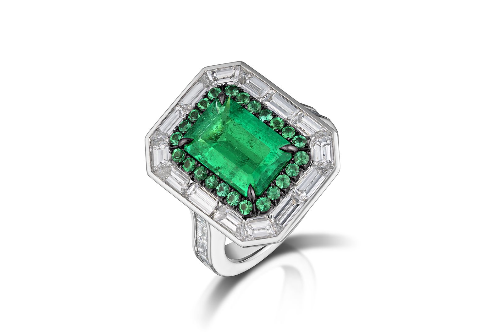  AGTA Spectrum Awards™ 2022 Bridal Wear 1st Place - Gabriel Angulo of Pompos Jewelry Corporation with a 2.55 carat rectangular emerald-cut Colombian emerald accented with 24 round emeralds, 22 custom-cut baguette diamonds and 62 round brilliant-cut diamonds in platinum 