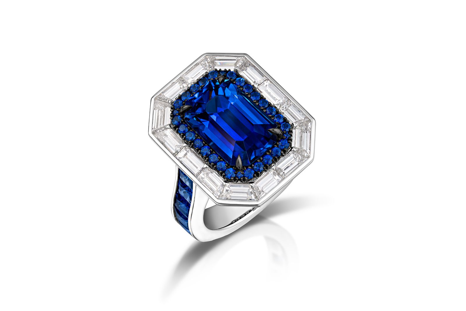  AGTA Spectrum Awards™ 2022 Classical 1st Place - Gabriel Angulo of Pompos Jewelry Corporation with a 6.29 carat blue Ceylon sapphire accented with 14 custom-cut baguette diamonds, 10 princess-cut sapphires, 30 round sapphires and 58 round brilliant-cut diamonds