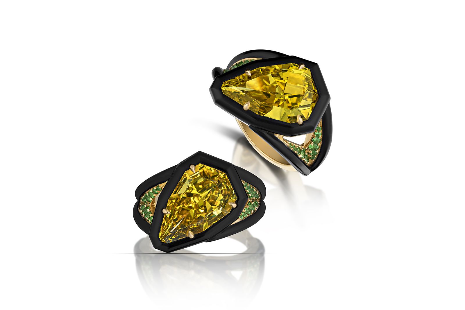 AGTA Spectrum Awards™ 2022 Fashion Forward & Evening Wear - 1st Place - Jeffrey Bilgore of Jeffrey Bilgore, LLC with an 18k yellow gold and black ceramic ring featuring a 4.03 carat natural fancy deep yellow diamond accented with 15 tsavorite garnets 