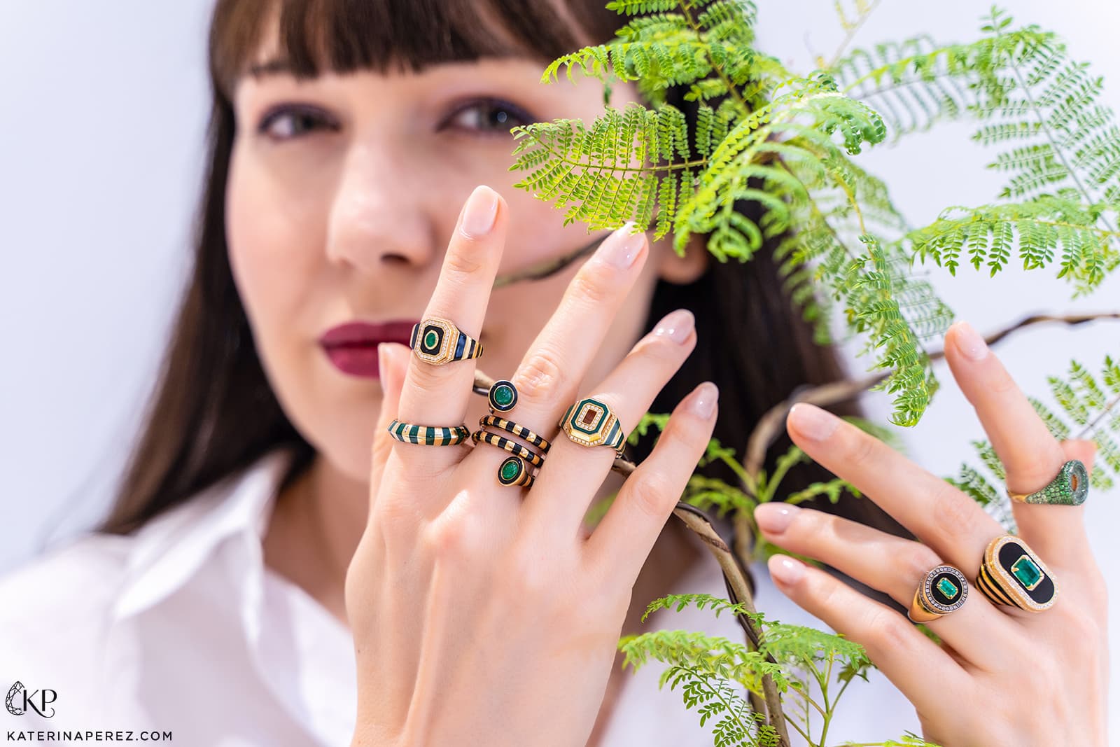  Katerina Perez wears yellow gold, black enamel, onyx and emerald signet-style rings by State Property 