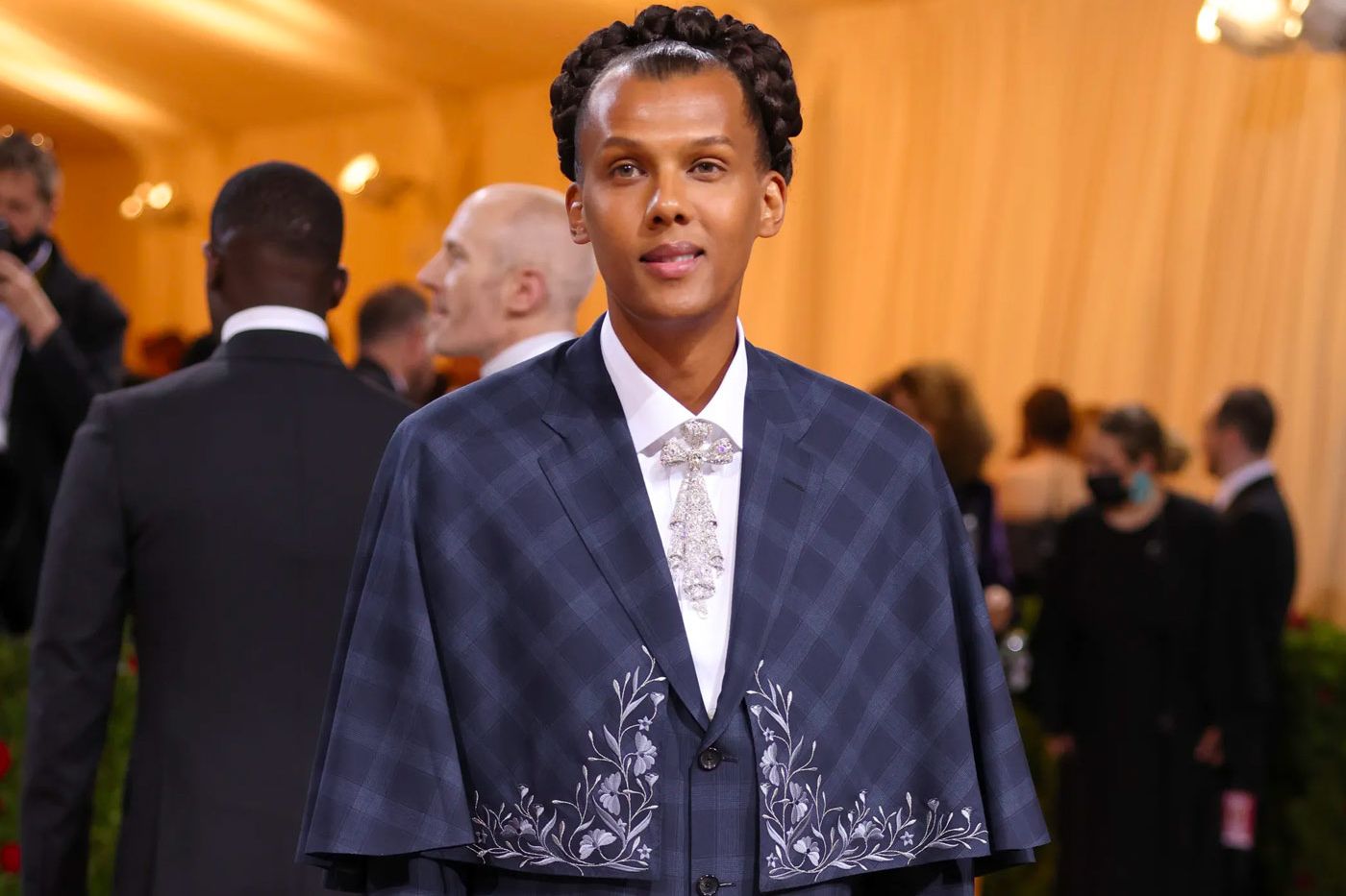Belgian singer-songwriter Stromae wearing a Cartier diamond-set brooch at the Met Gala 2022