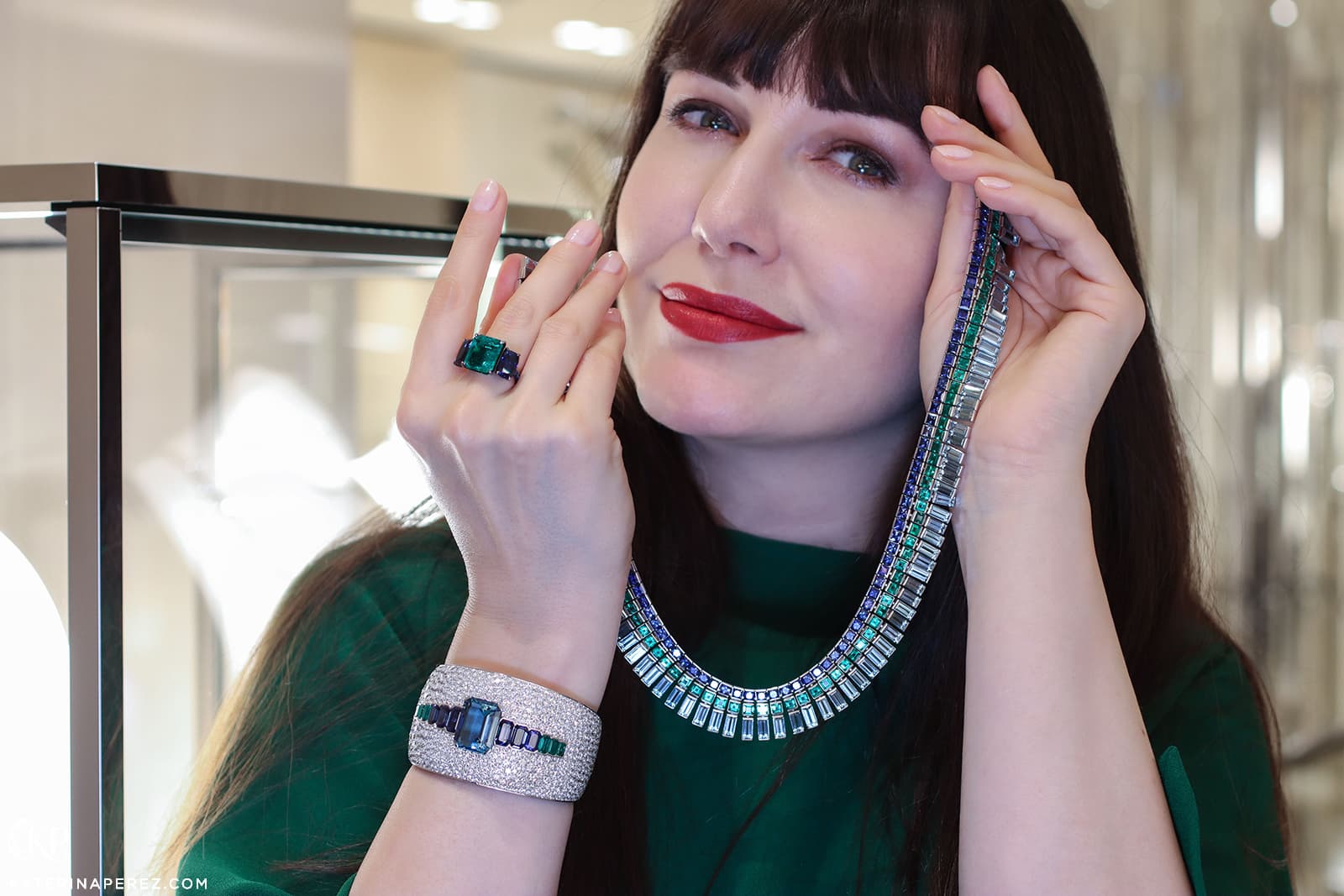 Katerina Perez wearing the Bucherer Fine Jewellery emerald, sapphire, aquamarine and diamond high jewellery sweet