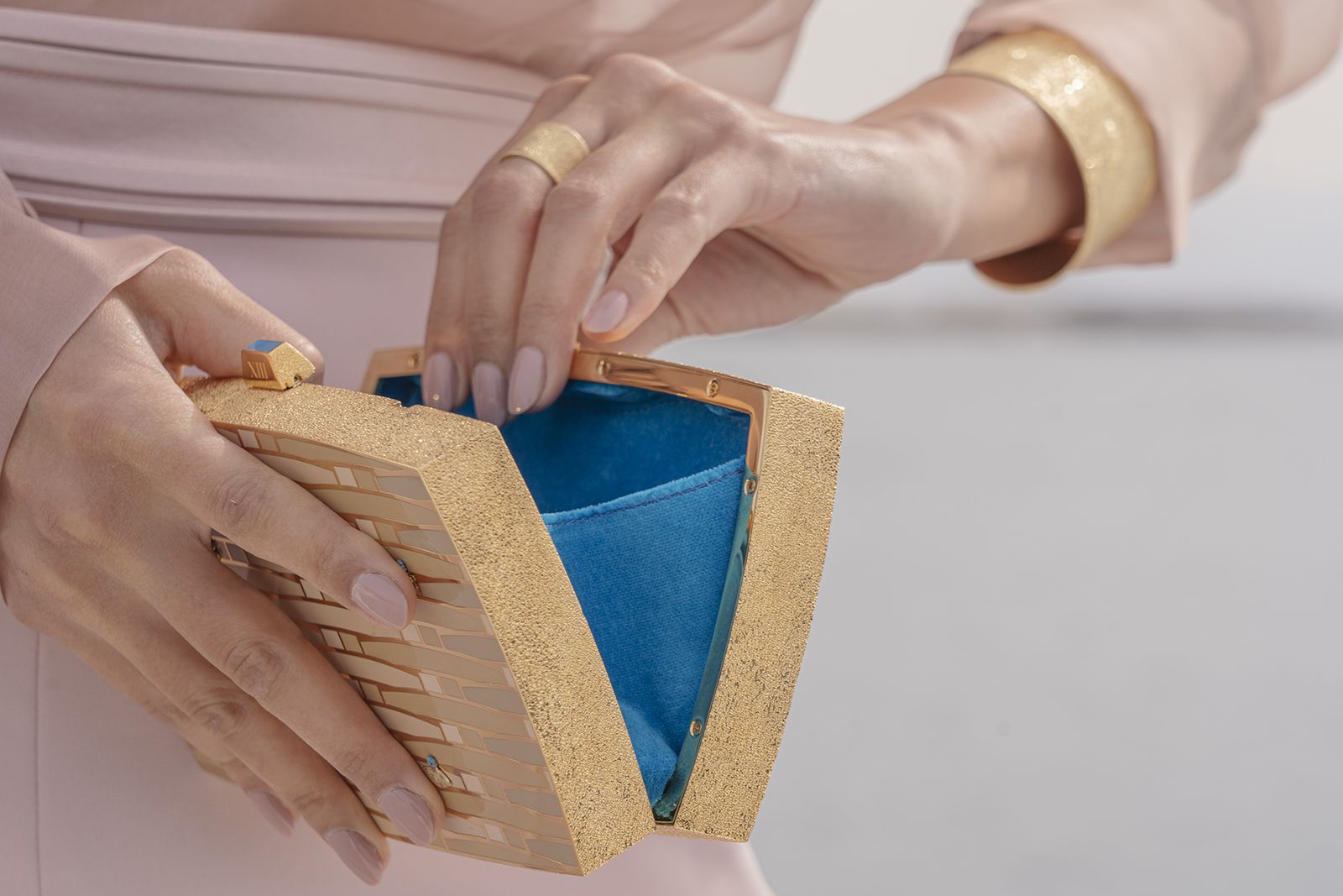  13BC x Carolina Bucci Clutch purse featuring brushed gold ring and bangle by Carolina Bucci