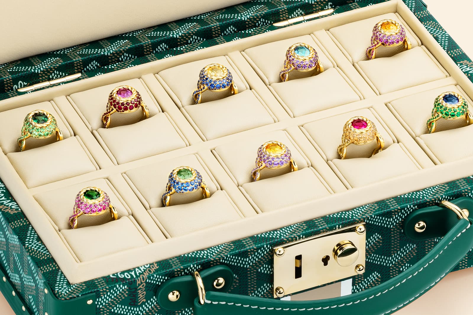 Close up of Maison Mellerio  rings in the specifically designed Goyard trunks