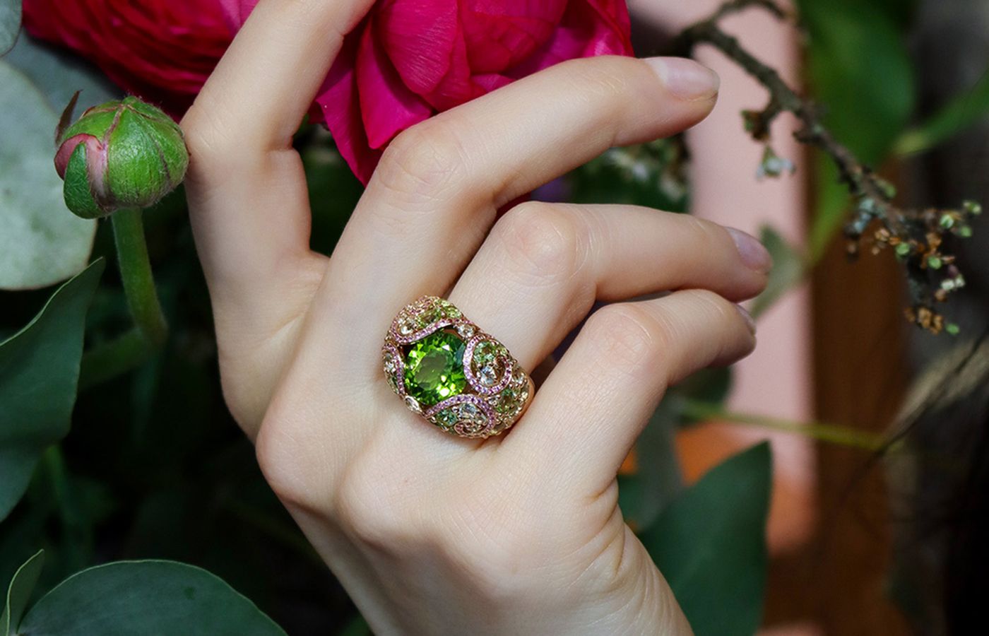 Katerina Perez wearing an  Isabelle Langlois Petals collection ring in yellow gold, peridot and coloured gemstones