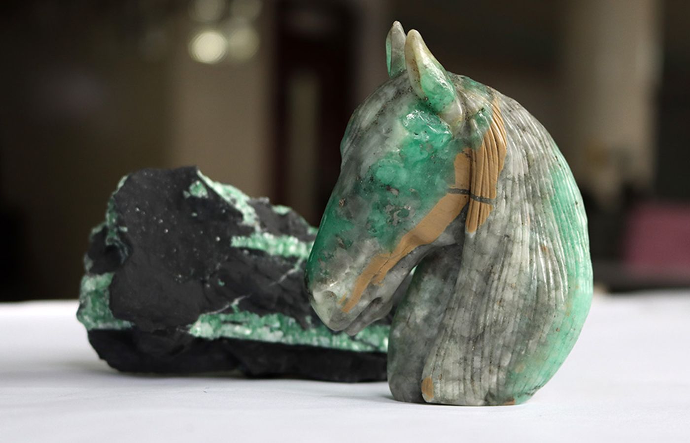 Unusual emerald carvings on display at the International Emerald Exchange (IEEX) in Colombia