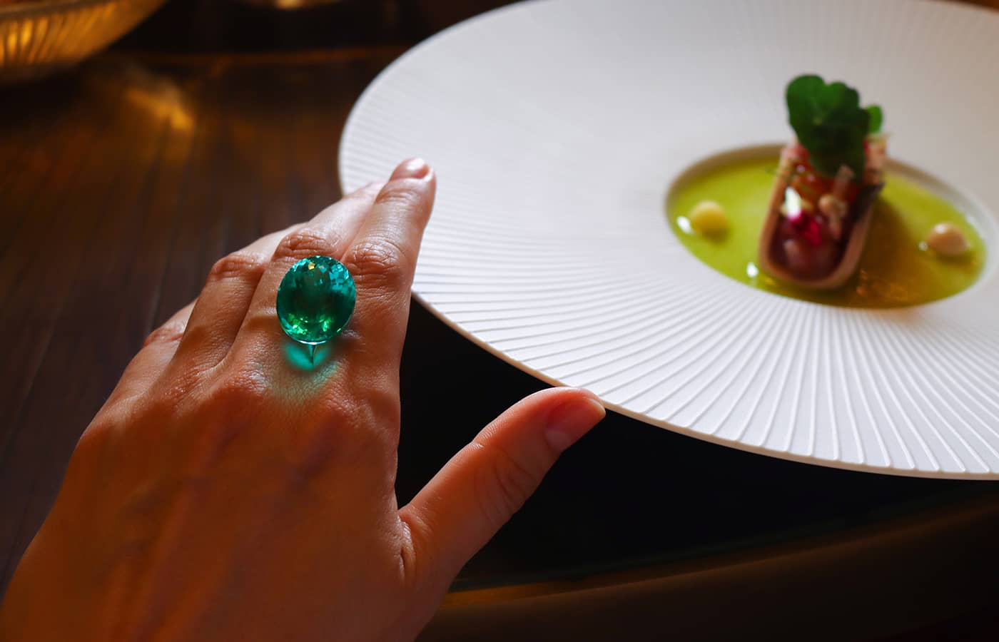  Katerina Perez enjoys a meal at La Butte aux Bois Hotel while discovering Paraiba tourmalines