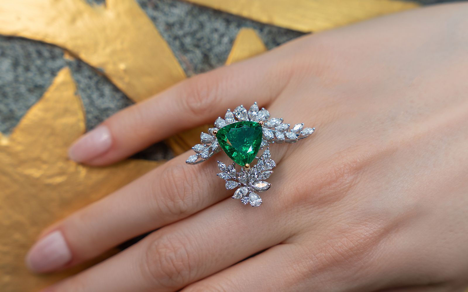 Caratell ring with a 6.99-carat Ethiopian emerald and diamond-set foliage