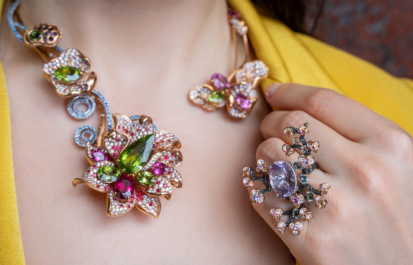  A closer look at the details of a Caratell necklace and the Plum Blossom cocktail ring 