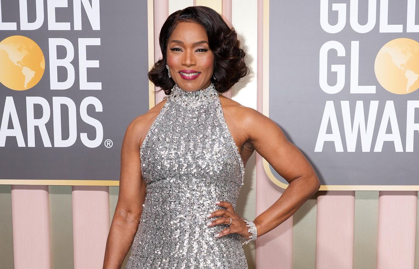 Angela Bassett in Chopard white gold and diamond earrings from the Precious Lace High Jewellery collection and a Fairmined-certified white gold and diamond bracelet from the Green Carpet High Jewellery collection