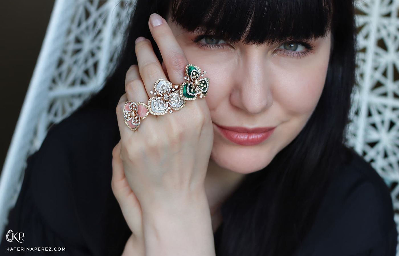  Katerina Perez wears  a trio of FerrariFirenze Clover rings with diamonds and coloured enamel