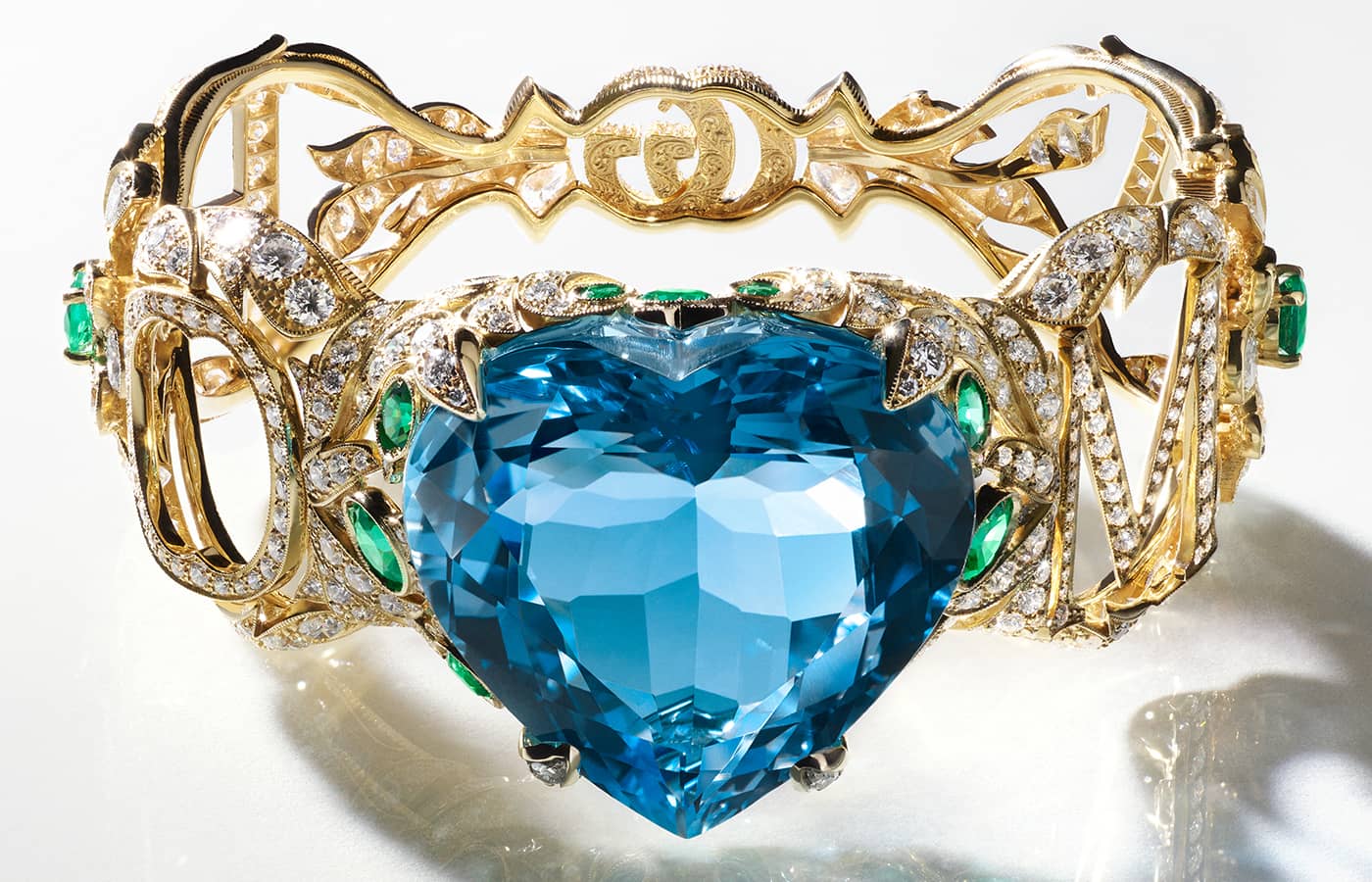  Gucci High Jewellery bracelet in gold, a 112-ct heart-shaped topaz, emeralds and diamonds from the Gucci Hortus Deliciarum High Jewellery collection 