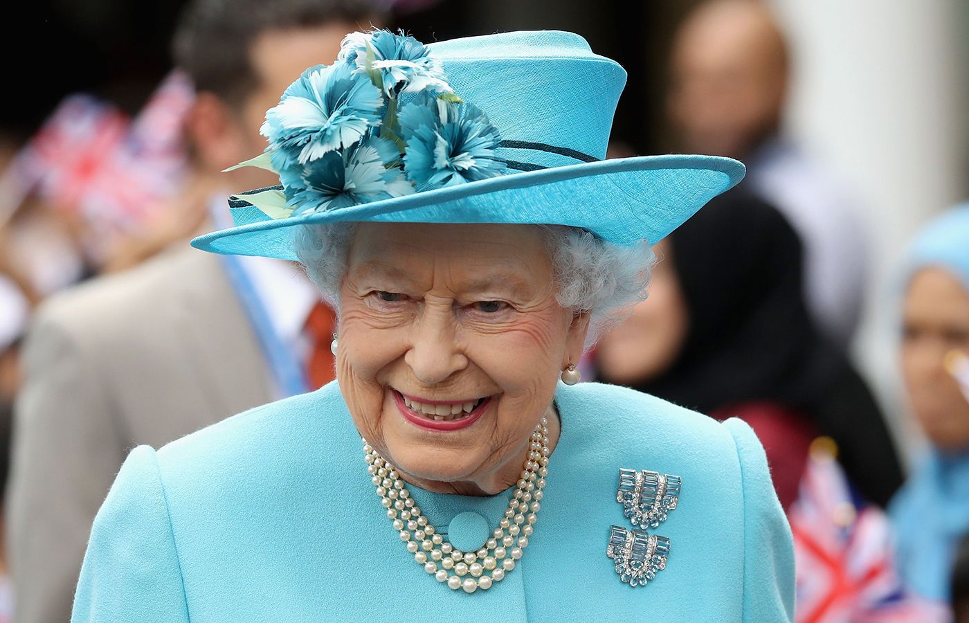Her Late Majesty Queen Elizabeth II wearing a Boucheron aquamarine and diamond double clip brooch (1937) gifted to her in the 1940s