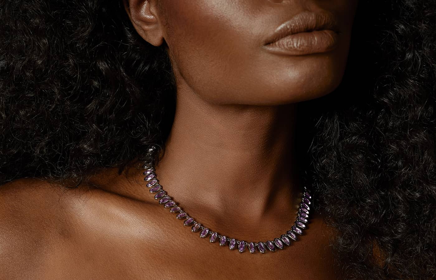  Model wearing gold and amethyst necklace by Nakard 