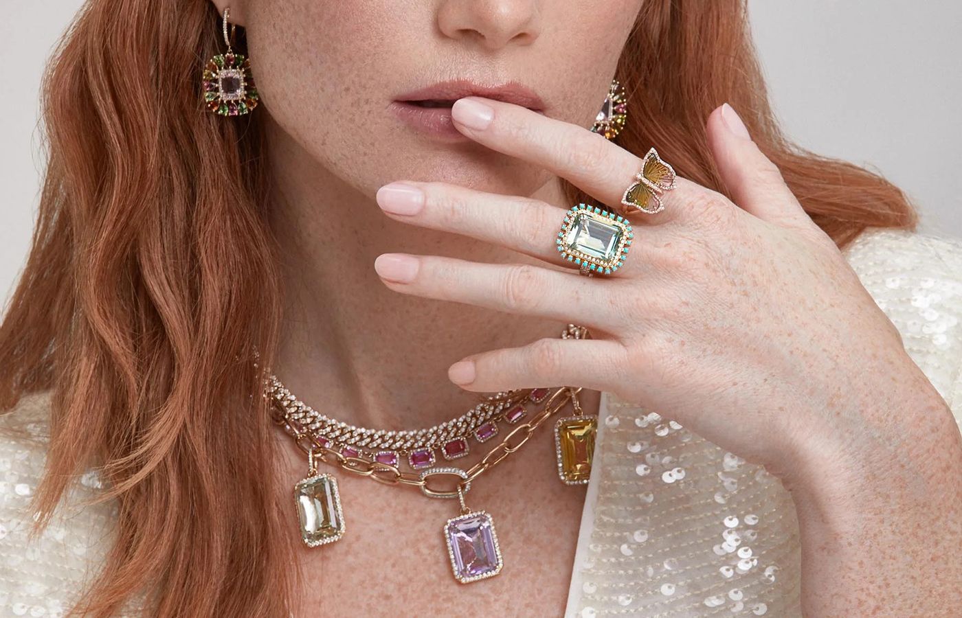  Model wearing green and purple amethyst jewellery by Anne Sisteron