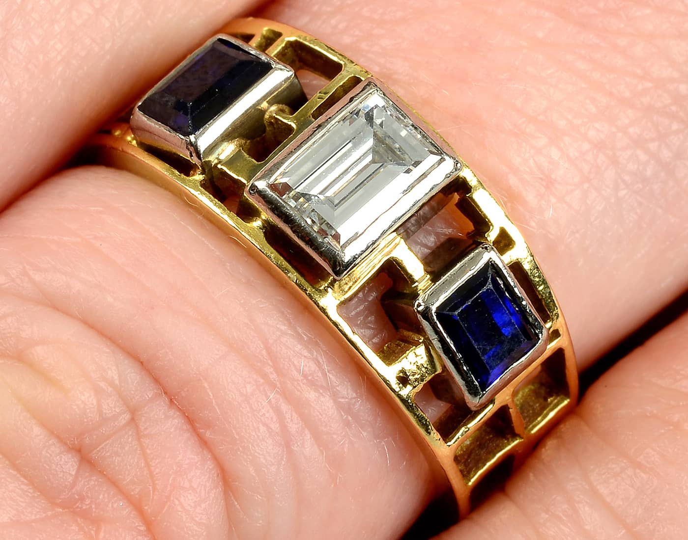  A mid 20th century gold rectangular-shape diamond and sapphire openwork ring by John Donald