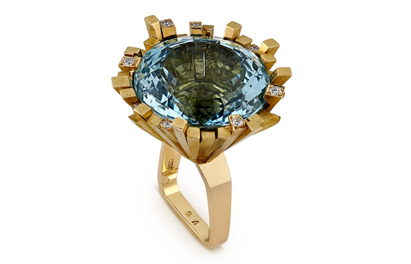  1969 matte yellow gold, round blue topaz and diamond ring  by Andrew Grima