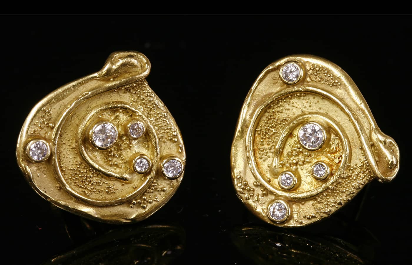  A pair of gold and diamond set earrings by Elizabeth Gage, 