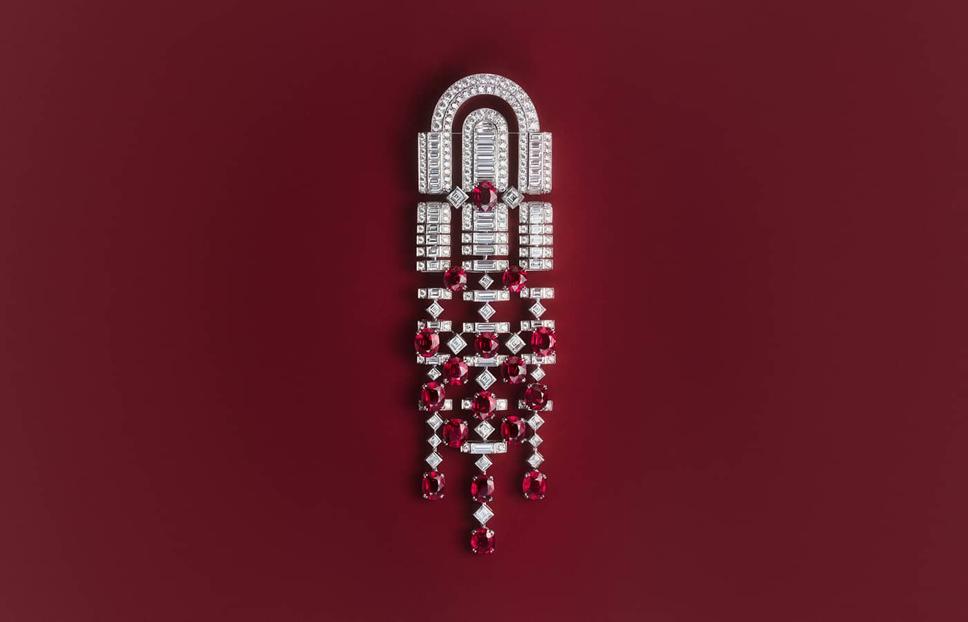  Rolling Red brooch set with 17 oval rubies from Mozambique totalling 18.82 carats and diamonds in 18k white gold from the Boucheron Like a Queen High Jewellery Collection