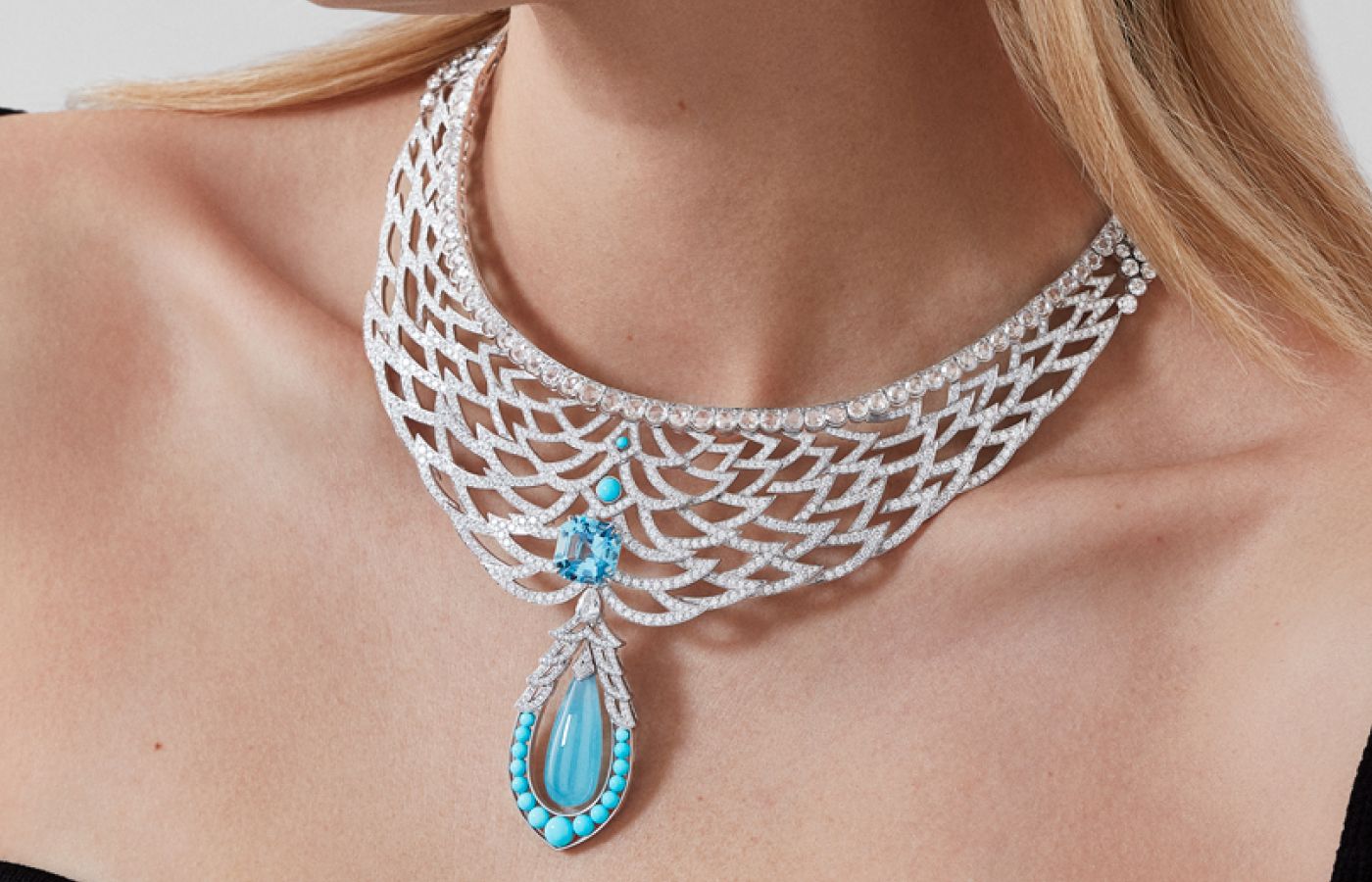  Model wearing Garrard Mustique necklace in white gold, aquamarine, diamond and turquoise from the Couture High Jewellery collection