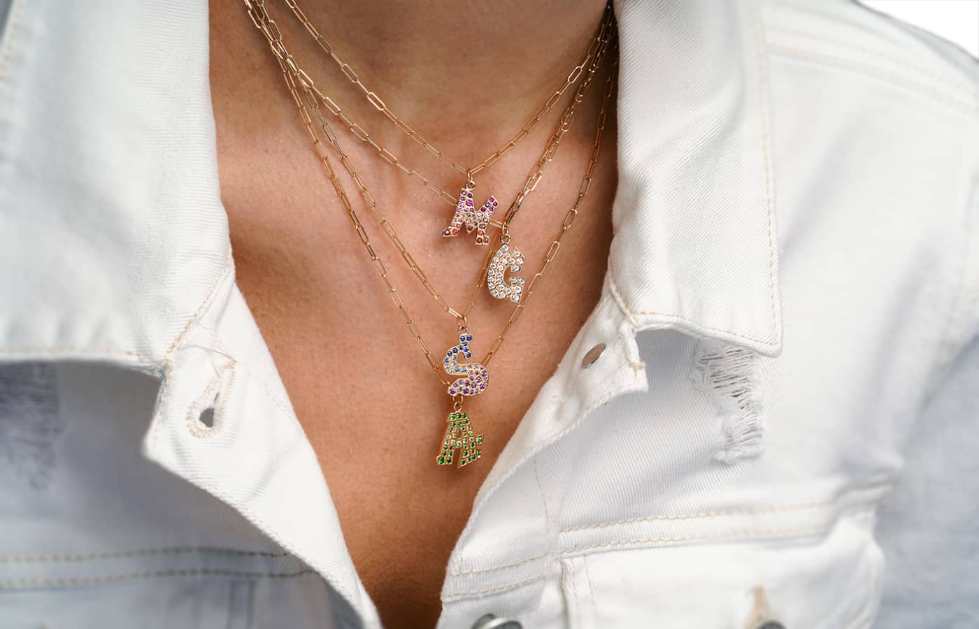  Gigi Ferranti Letter necklaces in gold, coloured gemstones and diamonds 