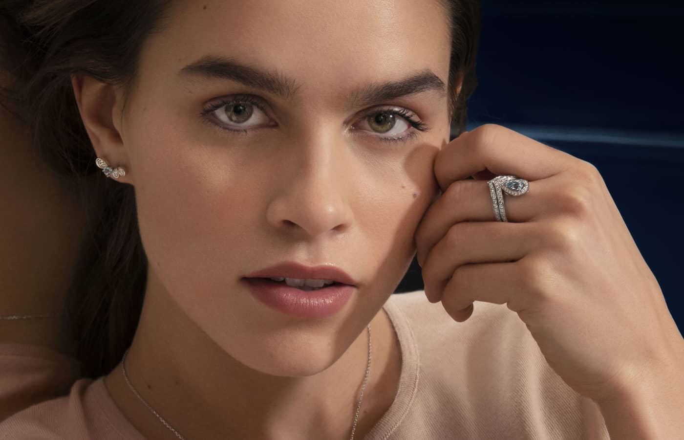 Model wearing Chaumet ring in white gold, aquamarine and diamond