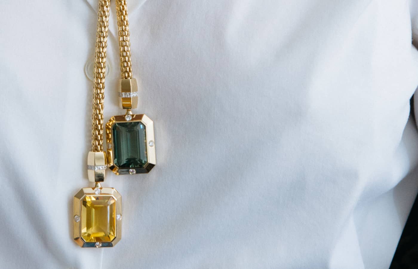  Model wearing Gemella gold, citrine and blue topaz necklace 