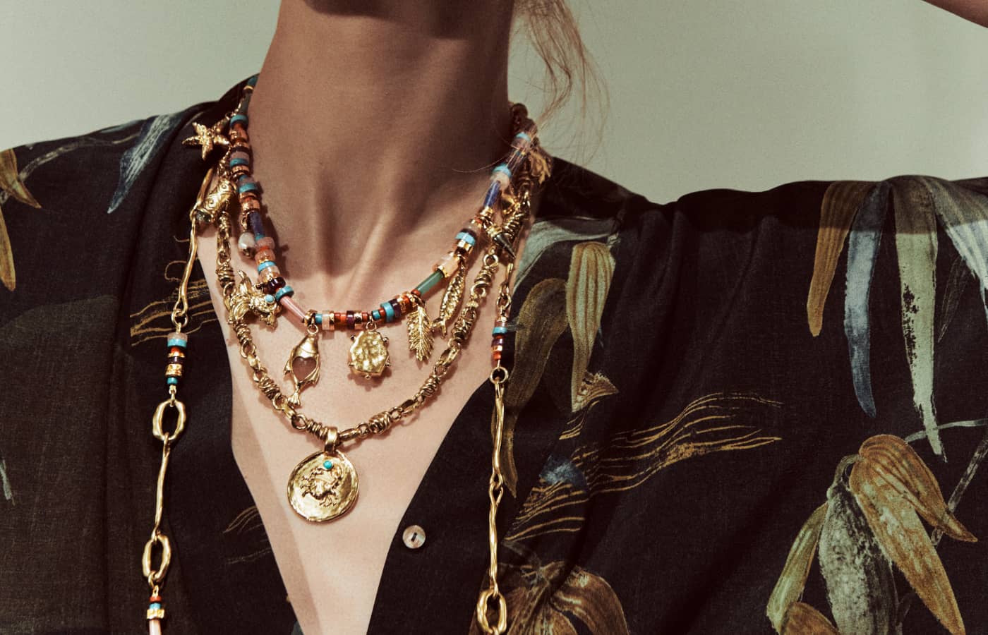  Model wearing GOOSSENS Talisman necklaces in gold and precious gemstones