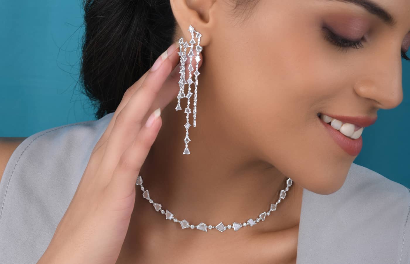  Model Wearing VAK Jewels Portrait earrings and necklace in white gold and portrait cut diamonds