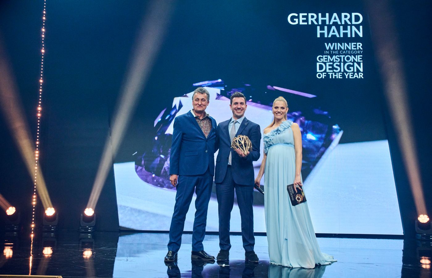  The team at Gerhard Hahn Fine Gems collect the trophy for ‘Gemstone Design of the Year’ at the Inhorgenta Awards 2023