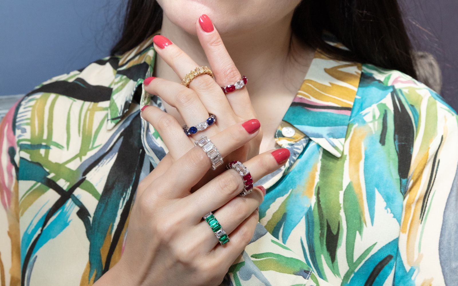 Katerina Perez wears a selection of ARAZI eternity rings set with diamonds and coloured gemstones