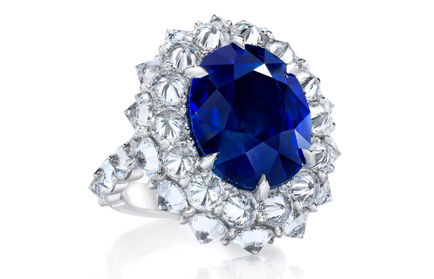  ARAZI oval-shaped sapphire ring surrounded by reverse-set round brilliant-cut diamonds 