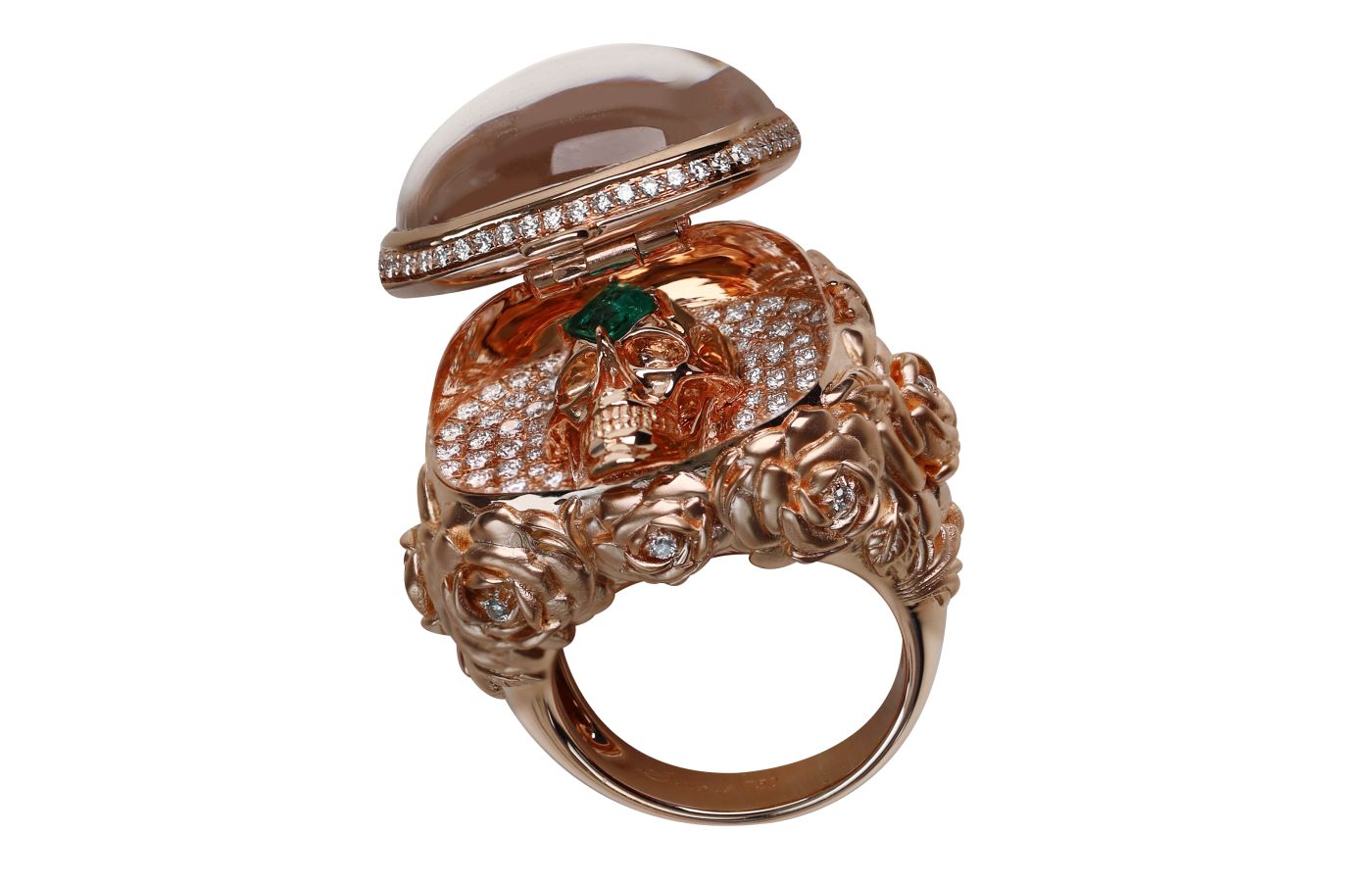  Beauty of Life secret ring with a hinged ‘lid’ of carved quartz, an 18k rose gold skull, diamonds, and a Columbian emerald from the TATTOO collection by Simone Jewels 