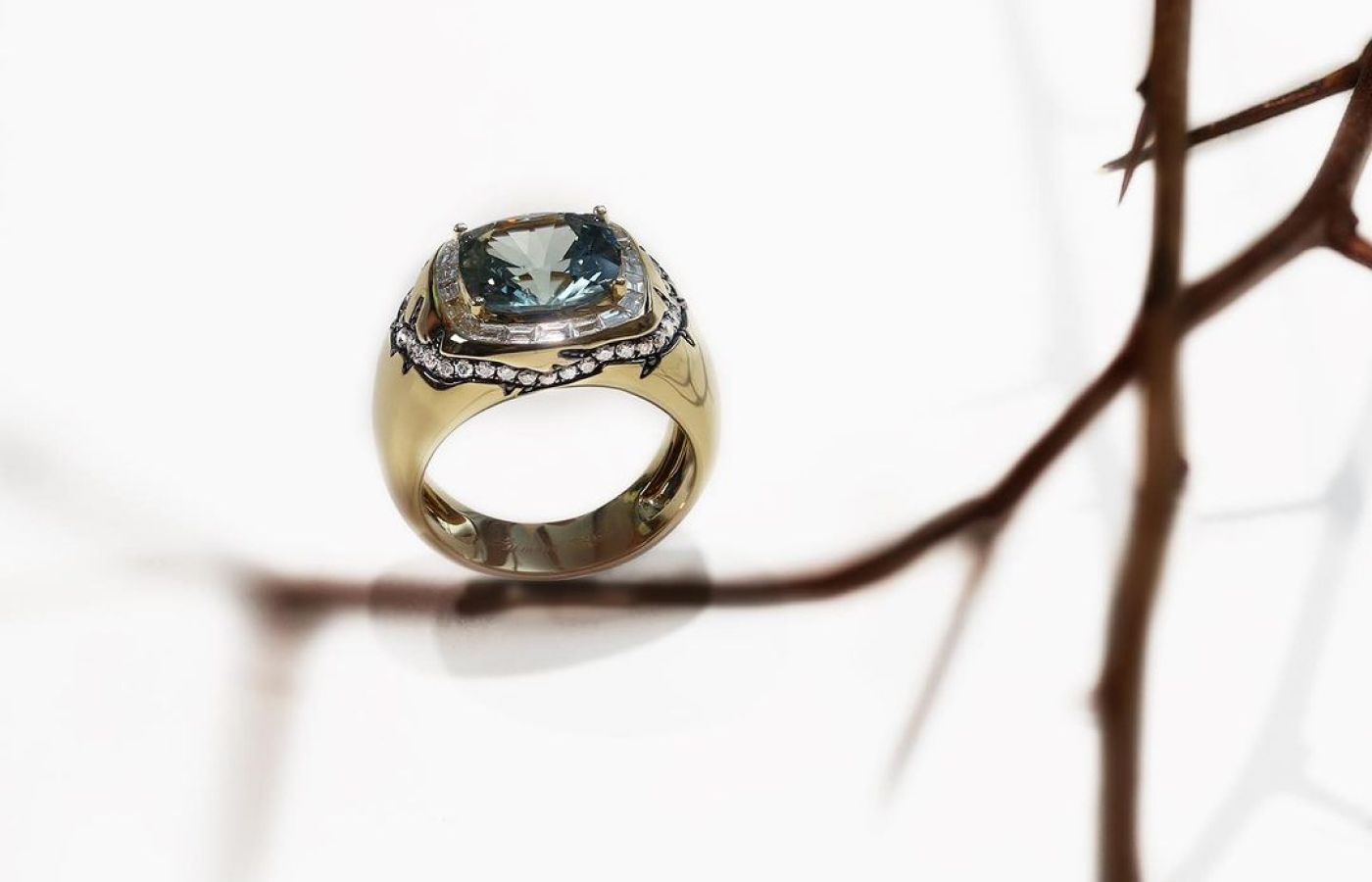 Beauty of Life ring set with an unheated blue sapphire and custom-cut invisible-set diamond baguettes from the TATTOO collection by Simone Jewels