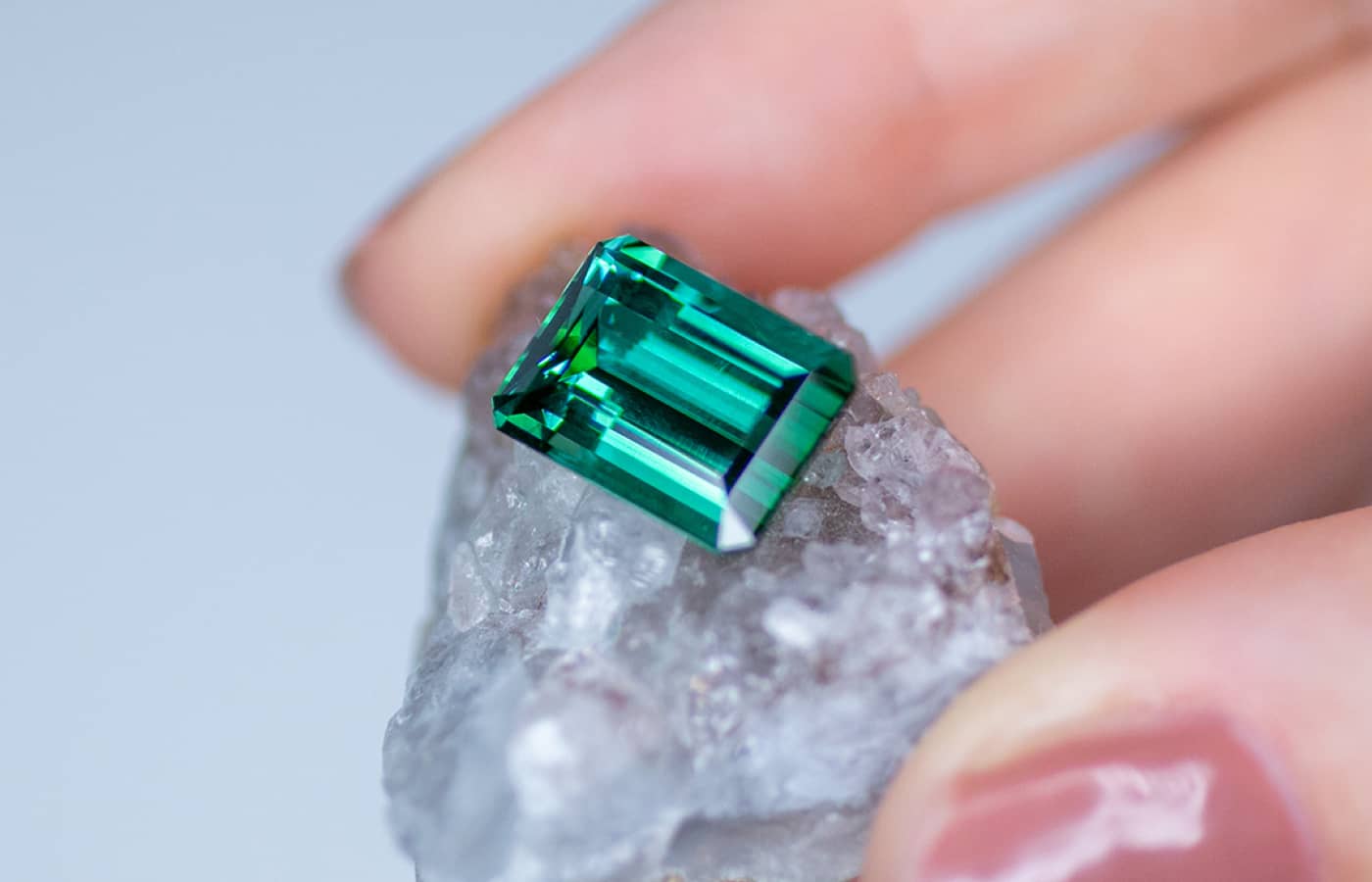 Katerina Perez holding a Gemhype 1.21-ct baguette-cut tourmaline
