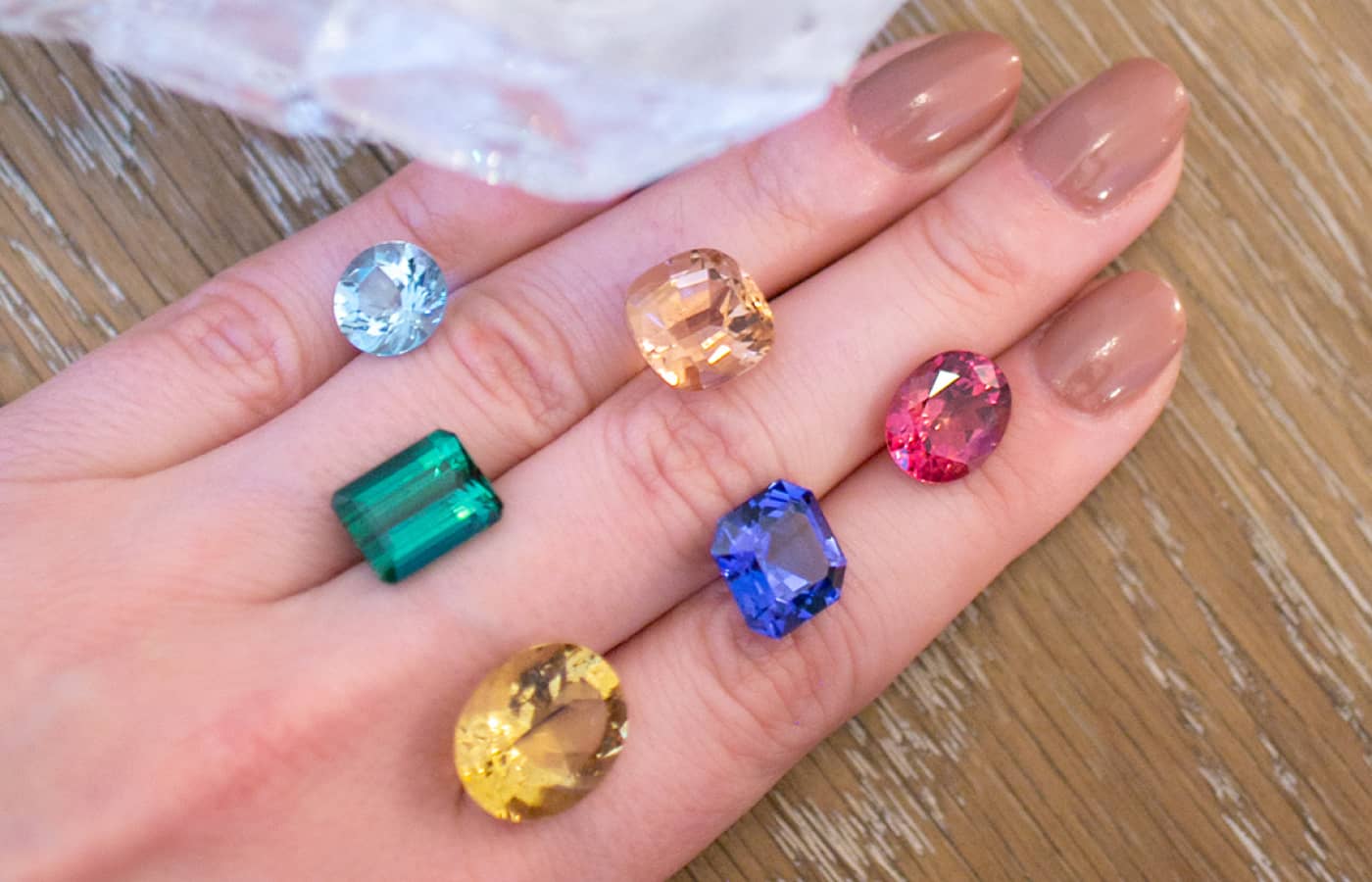  Katerina Perez holding tourmalines, aquamarines, tanzanites and beryls